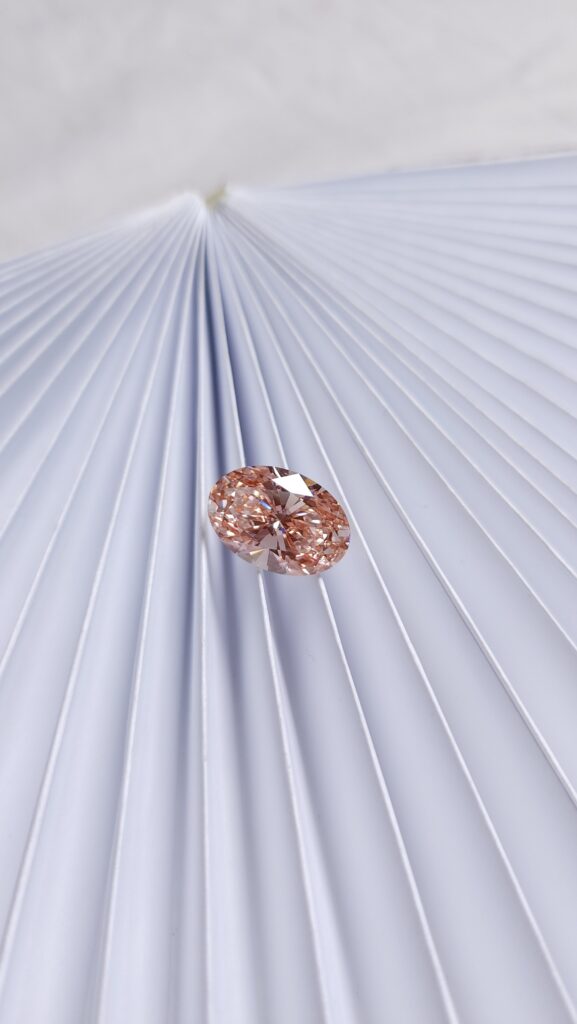 Shades fancy lab-colored pink diamond | oval shape diamond in pink