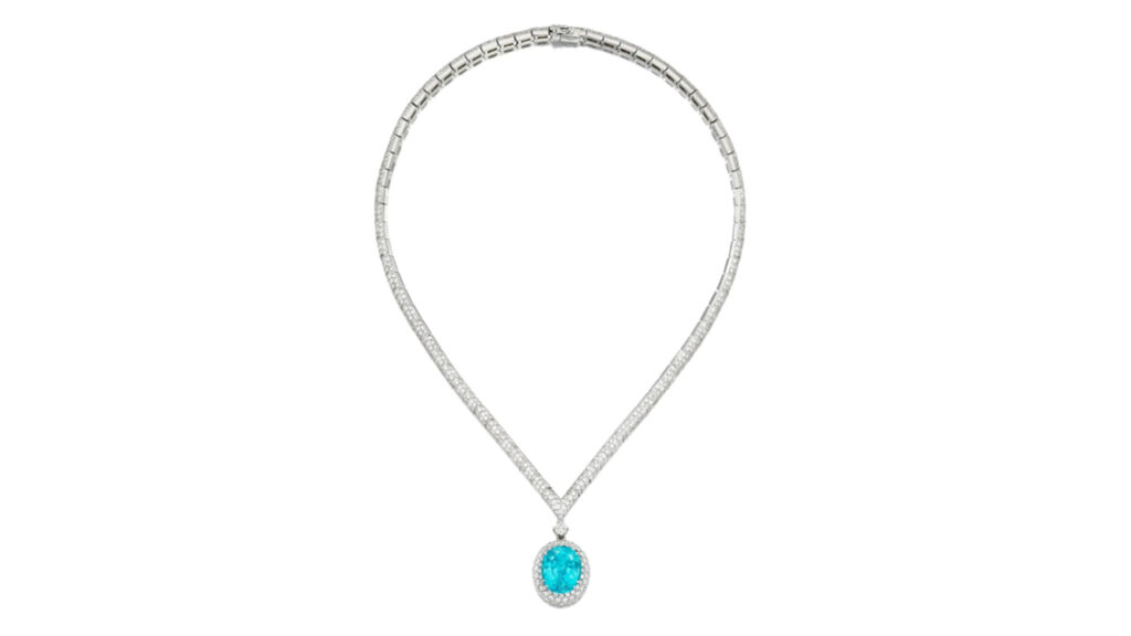 Silver necklace with turquoise gemstone pendant.