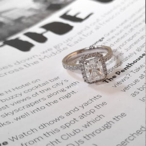 Diamond ring on magazine page.