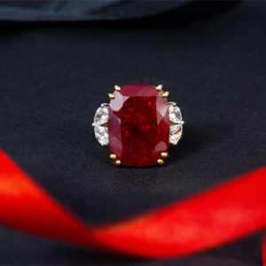 Elegant ruby and diamond ring on black background